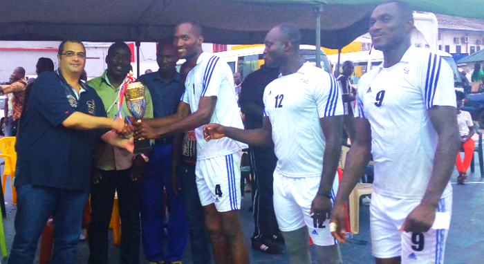  Mr. Nouhad Kalmoni, left, presents the trophy to Daniel Benefo, captain of the Army team